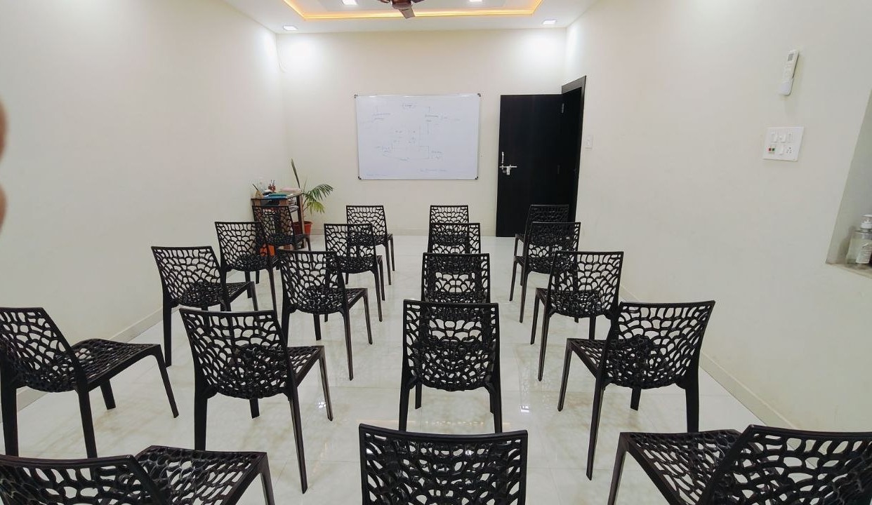 Bright modern office reception area with plants and warm lighting, welcoming atmosphere